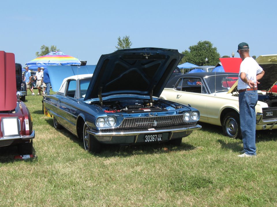 Blue 1967 Ford Thunderbird convertible front view with hood open