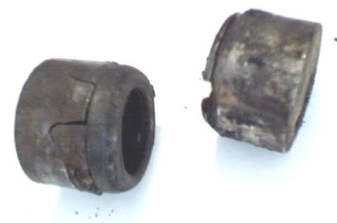 1989 Ford Bronco - Side view of caps. One on the left is cracked and the one on the right has a small chunk gone.