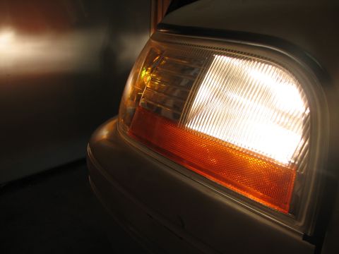 2003 Ford Crown Victoria - Front corner of a 2003 Ford Crown Victoria showing the headlight and turn signal assembly.