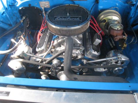 1957 Chevrolet Bel Air - Close-up view of a modified V8 engine bay, an aftermarket air cleaner and chrome components.