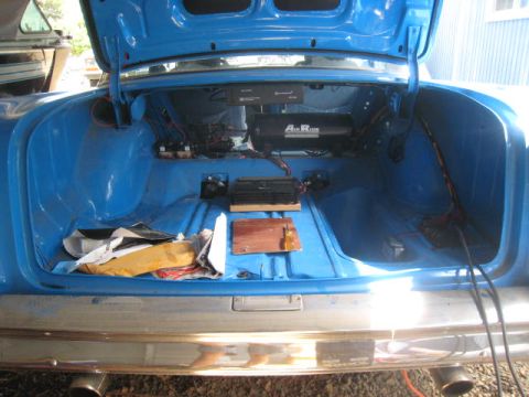 1957 Chevrolet Bel Air - The trunk of a 1957 Chevrolet Bel Air shows custom air suspension components and wiring.