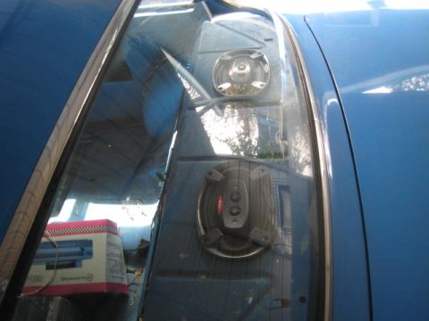 1957 Chevrolet Bel Air - The interior of a blue vehicle is visible, with a box and some interior components.