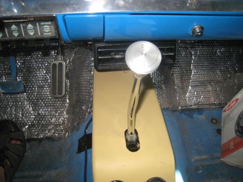 1957 Chevrolet Bel Air - Interior view of a 1957 Chevrolet Bel Air, highlighting the floor-mounted shifter and dashboard details.