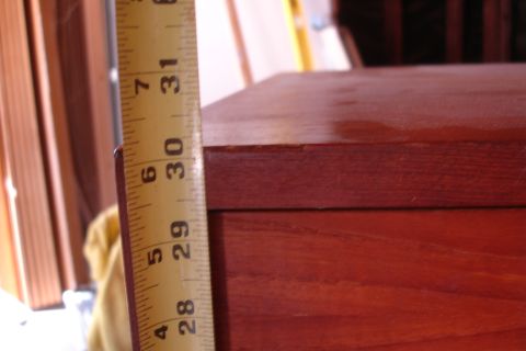 1993 Ford Taurus - A wooden box is measured with a tape measure, showing measurements from 28 to 31 inches.