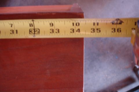 1993 Ford Taurus - Measuring tape shows the length of a wooden surface, indicating measurements up to 36 inches.