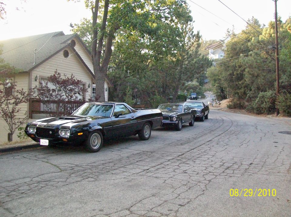1972 Ford Ranchero parked on street with two other cars behind it