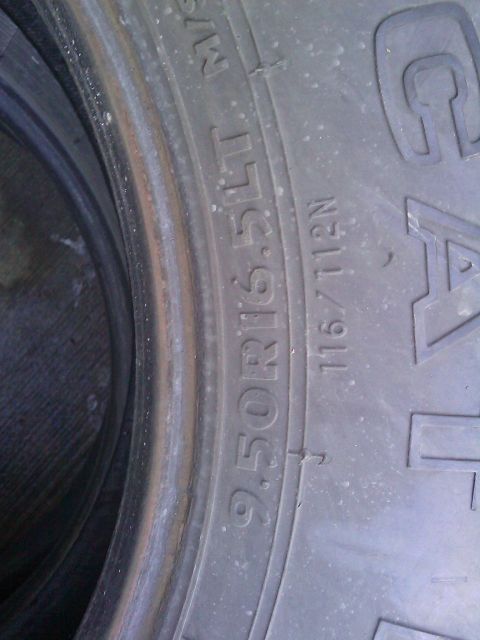 1996 Ford Bronco - Close-up of a tire's sidewall shows size and load rating information.
