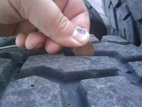 1996 Ford Bronco - A penny is used to measure the tread depth of a tire.