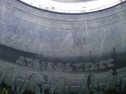 1996 Ford Bronco - Close-up of a tire showing its size and load range markings.