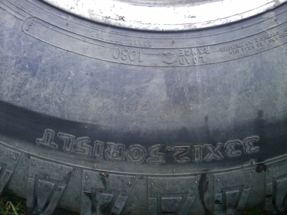 Tire with text 33x12.50R15LT and load range 1030