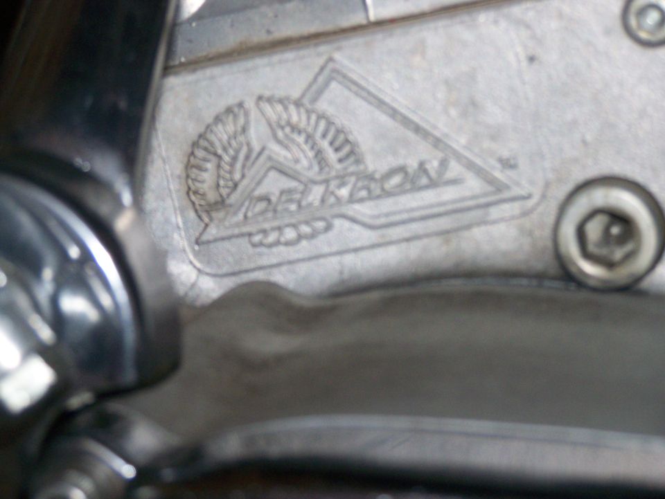 Delkron engine part with winged logo