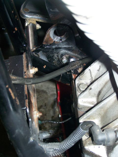 1988 Suzuki Samurai - Detail shot of vehicle mechanical components, including engine block and frame structure.