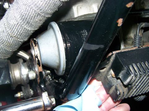 1988 Suzuki Samurai - A close-up view of a component on the underside of a vehicle, possibly related to the drivetrain or suspension.