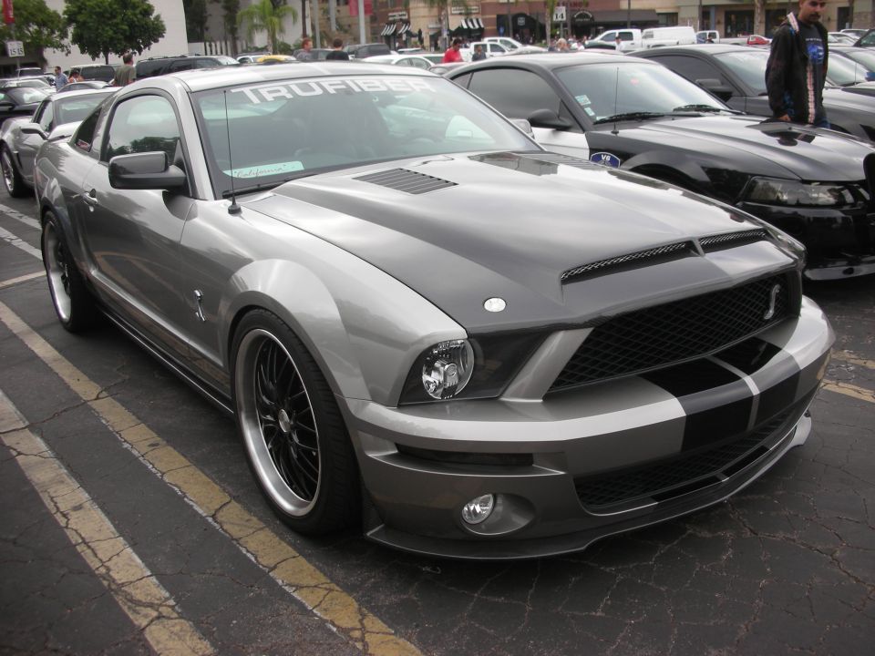 Gray 2007 Ford Mustang Shelby GT500 with black racing stripes on hood and trunk