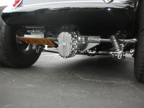 1998 Ford Crown Victoria - The rear suspension and differential of a custom vehicle are shown in detail, with a license plate visible.