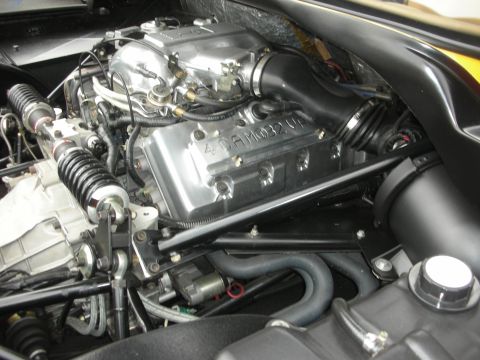 1998 Ford Crown Victoria - Close-up of a V8 engine with "4.6L 32V" visible on the valve cover.