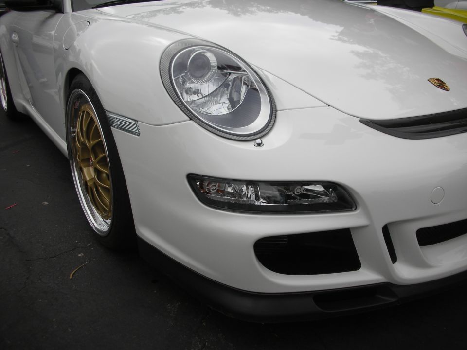 White Porsche 911 front quarter with gold BBS wheels