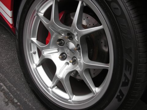 1998 Ford Crown Victoria - Close-up of a silver wheel with a red brake caliper and a Goodyear tire.