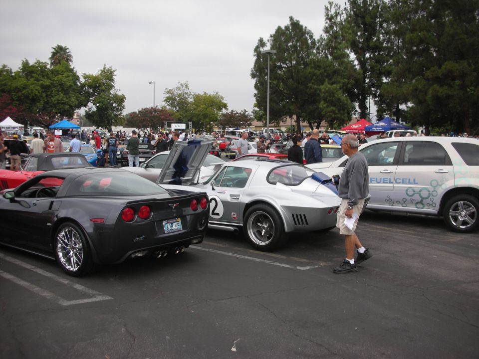 Dark gray Chevrolet Corvette rear view with chrome wheels