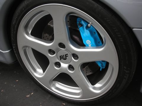 1998 Ford Crown Victoria - Close-up of a silver RUF wheel a bright blue Brembo brake caliper.