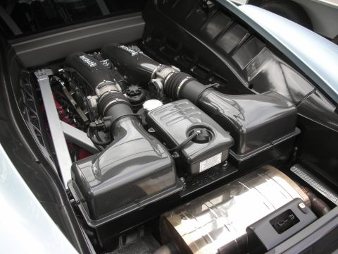 1998 Ford Crown Victoria - Close-up view of a car's engine bay, showing intake and exhaust components.