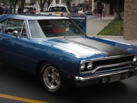 1998 Ford Crown Victoria - A blue muscle car with black racing stripes is seen from the front-three-quarter view, a 1970 license plate.