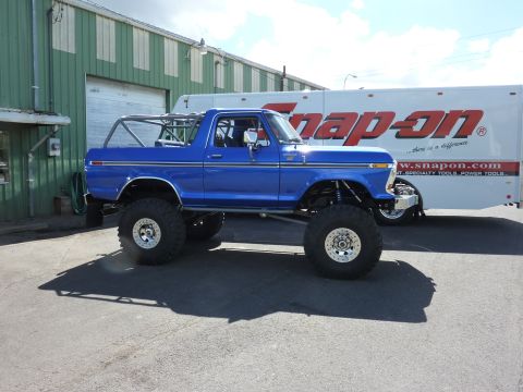 1981 Kenworth W900A - This lifted 1978 Ford Bronco features a roll cage and is parked next to a Snap-On trailer.