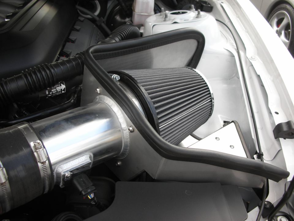 Engine air intake with black cone filter and aluminum piping