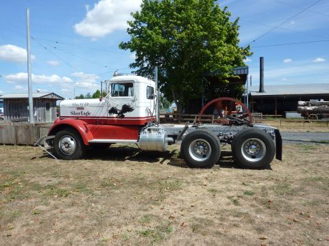 1981 Kenworth W900A - This semi-truck tractor is painted white and red and features 'Silver Eagle' graphics on its side.