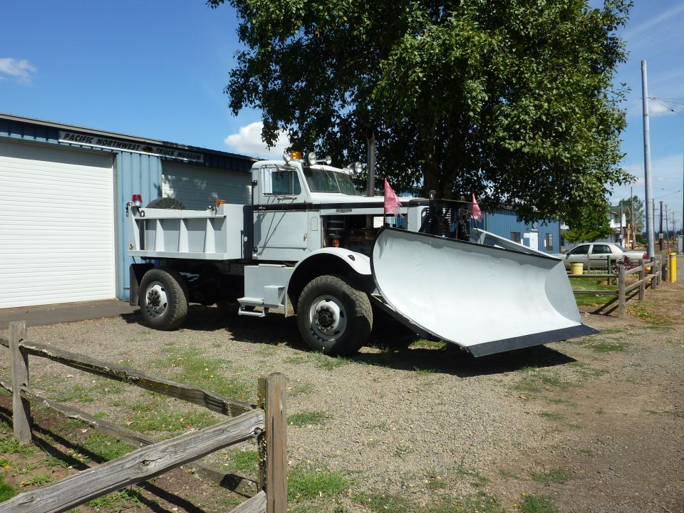 Dump truck with snow plow, front view, light gray
