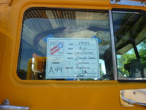 1981 Kenworth W900A - A card displayed on the truck's window provides details about the vehicle, including its year, make, and owner.