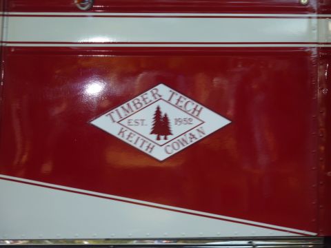 1981 Kenworth W900A - Side view of a red and white truck the Timber Tech Keith Cowan logo, established in 1952.