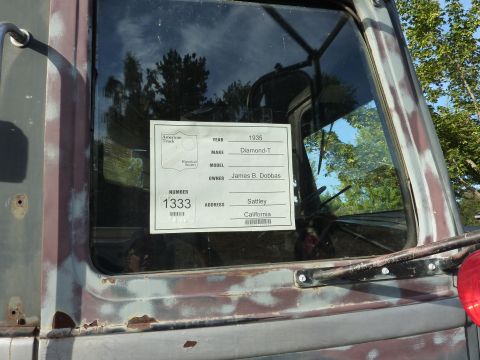 1981 Kenworth W900A - A Diamond-T truck from 1935 is shown from the side, with a sign in the window providing registration details.
