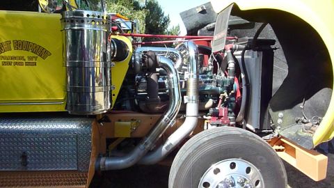 1981 Kenworth W900A - Close-up view of a truck's engine compartment, showing exhaust and turbo components.