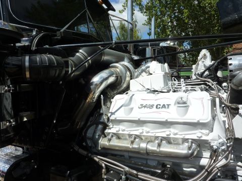1981 Kenworth W900A - Close-up view of a truck's engine compartment, showing the "3408 CAT" engine and associated plumbing.