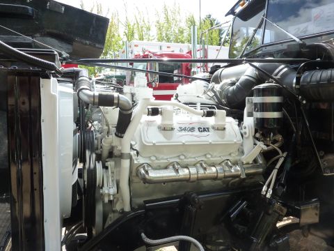 1981 Kenworth W900A - Close-up view of a white CAT 3408 engine, with visible hoses and plumbing.