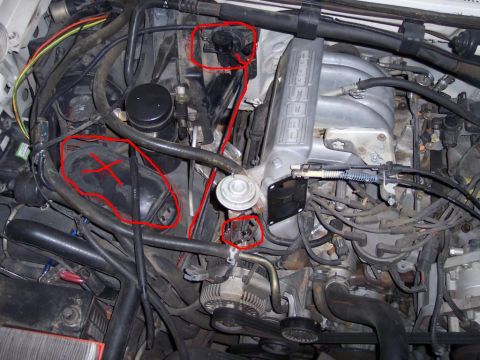 1988 Ford Bronco - Close-up view of an engine bay with various components circled in red.