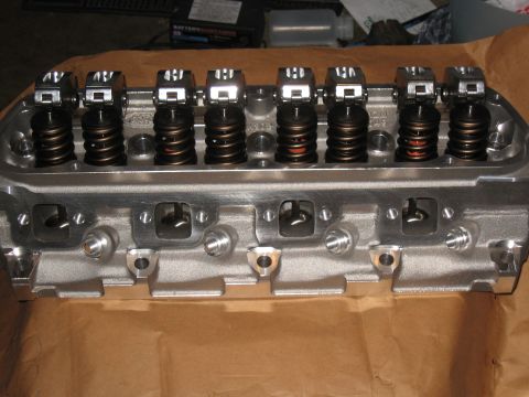 1994 Ford Bronco - Close-up view of an engine cylinder head, its internal components like rocker arms and valve springs.