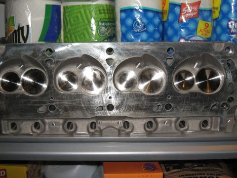 1994 Ford Bronco - Close-up view of an engine cylinder head, showing the intake and exhaust ports and valves.