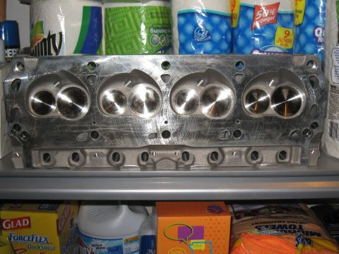1994 Ford Bronco - Close-up of an engine cylinder head, showing the valve ports and combustion chambers.