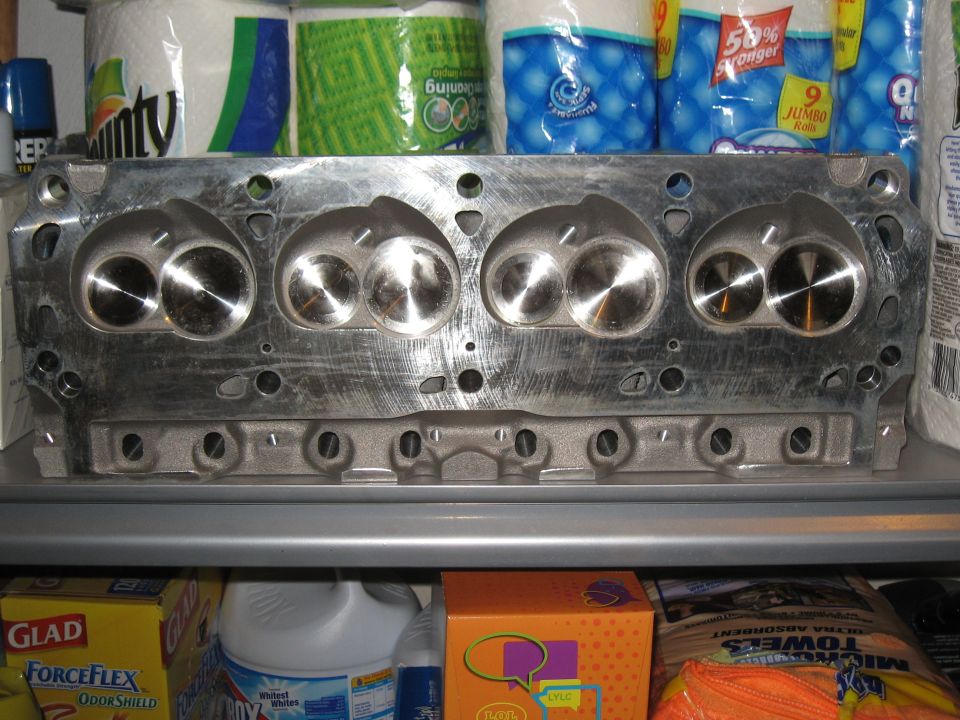 Engine cylinder head with four intake and four exhaust valves visible