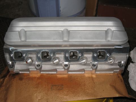 1994 Ford Bronco - A close-up view of an engine's cylinder head, showing the intake and exhaust ports.