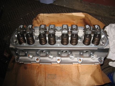 1994 Ford Bronco - Close-up of an engine cylinder head, showing internal components and Ford branding.