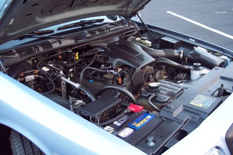 2001 Ford Crown Victoria - Engine bay of a 2001 Ford Crown Victoria, viewed from the front passenger side.