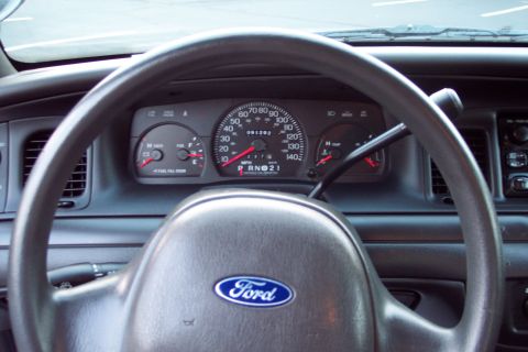 2001 Ford Crown Victoria - The interior of a 2001 Ford Crown Victoria shows the dashboard, steering wheel, and instrument cluster.