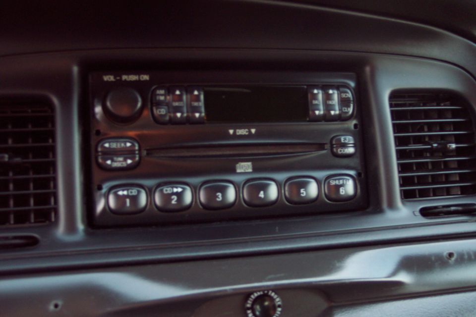 Car interior showing radio with CD player and air vents