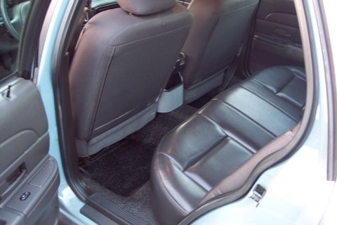 2001 Ford Crown Victoria - Rear interior view of a 2001 Ford Crown Victoria, highlighting the seating and door trim.