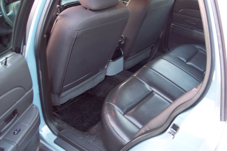 2001 Ford Crown Victoria interior showing rear seats and door panel