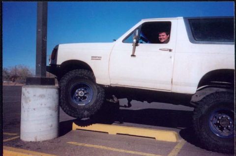 1987 Ford Bronco - driving up a pole