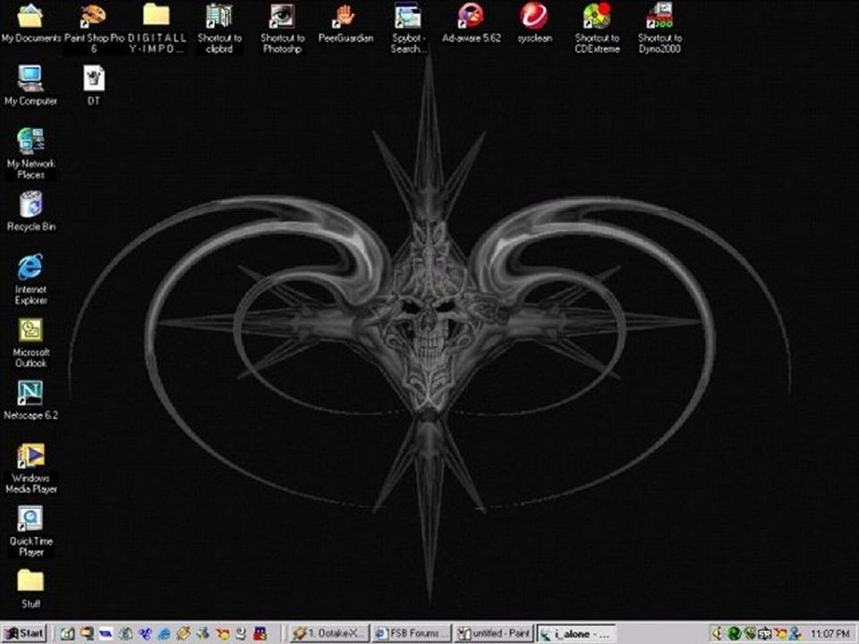 Computer desktop with tribal skull wallpaper and various program shortcuts
